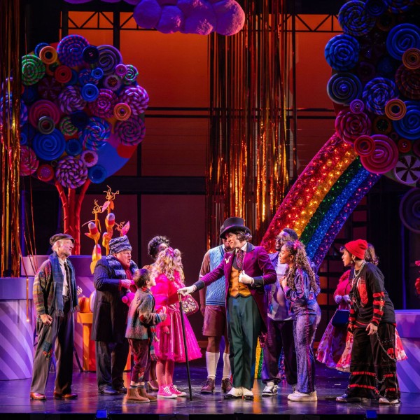Pictured: The Cast of CHARLIE AND THE CHOCOLATE FACTORY. Photo by Dahlia Katz. Directed by Jan Alexandra Smith. Set Design by Scott Penner. Costume Design by Joseph Abetria. Lighting Design by Siobhan Sleath.