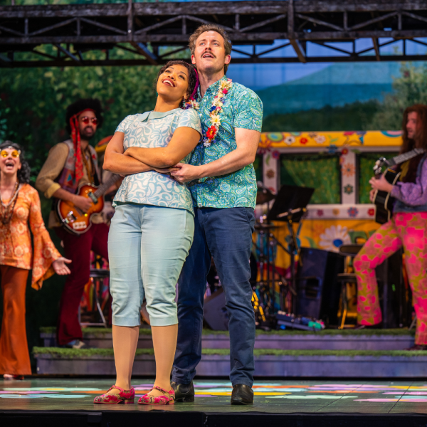 Pictured: The Company of AS YOU LIKE IT. Director: Daryl Cloran. Music Director: Ben Elliott. Choreographer/Fight Designer: Jonathan Purvis. Set Designer: Pam Johnson. Costume Designer: Carmen Alatorre. Lighting Designer: Hina Nishioka. Sound Designer: Owen Hutchinson. Stage Manager: Christine Leroux. Photo by Dahlia Katz.  