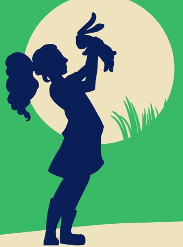 A silhouette of a girl holding up a rabbit