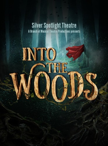 'Into the Woods' in large yellow text begins to be entangled by the roots of the surrounding dark woods. A red cloak can be seen in the background where some light breaks through the canopy.