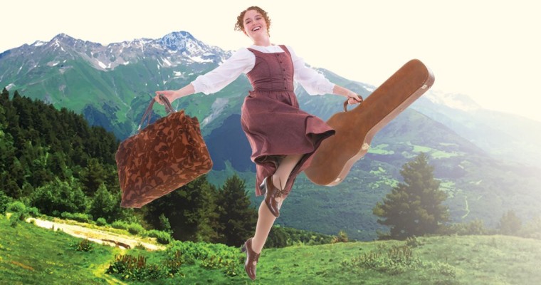 A woman in a white blouse and simple dress smiles as she holds a guitar case in one hand and a suitcase in another. In the background are lush green hills and mountains.