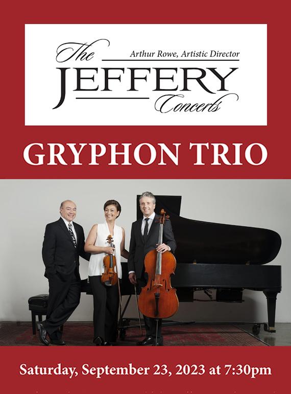 The three members of the Gryphon Trio stand in front of a piano as they pose with their instruments.